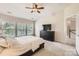 Bedroom with soft, neutral walls, plush carpeting, and large windows facing the exterior of the home at 5832 Lagrande Dr, Charlotte, NC 28269