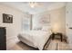 Bedroom with neutral carpet and walls, a ceiling fan, and lots of light from the large windows at 5832 Lagrande Dr, Charlotte, NC 28269
