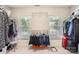 Spacious walk-in closet with dual windows and ample storage space at 5832 Lagrande Dr, Charlotte, NC 28269
