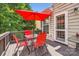 Enjoy outdoor dining on this deck with an umbrella, perfect for summer gatherings at 5832 Lagrande Dr, Charlotte, NC 28269