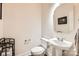 Cozy half bathroom featuring a pedestal sink and toilet with neutral wall color at 5832 Lagrande Dr, Charlotte, NC 28269
