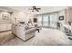 Inviting living room featuring large windows, a fireplace, and plush seating perfect for relaxation at 5832 Lagrande Dr, Charlotte, NC 28269