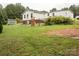 Spacious backyard with lush lawn, a deck and privacy fence, perfect for outdoor entertaining at 6213 Golden Oak Ln, Denver, NC 28037