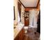 Bathroom with a double sink vanity, framed shower, and organized toiletries at 6213 Golden Oak Ln, Denver, NC 28037
