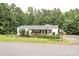 Exterior view of a charming home with a covered porch and a well-maintained lawn at 6213 Golden Oak Ln, Denver, NC 28037