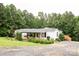 Charming single-story home with a covered front porch and lovely landscaping at 6213 Golden Oak Ln, Denver, NC 28037