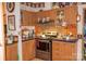 Cozy kitchen with wooden cabinets, stainless steel appliances, and tiled backsplash at 6213 Golden Oak Ln, Denver, NC 28037