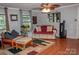 Inviting living room with hardwood flooring, a ceiling fan, and comfortable seating at 6213 Golden Oak Ln, Denver, NC 28037