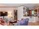 Inviting living room and kitchen featuring warm ambiance, modern furniture, and neutral wall tones at 6213 Golden Oak Ln, Denver, NC 28037