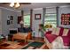 Living room with hardwood flooring, neutral walls, and a comfortable sofa and chair at 6213 Golden Oak Ln, Denver, NC 28037