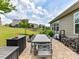 Spacious brick patio with outdoor dining furniture, a lush green lawn, and privacy at 8035 Pastime Ln, Clover, SC 29710
