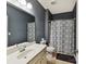 Bathroom featuring a shower with patterned curtain, vanity and large mirror at 8035 Pastime Ln, Clover, SC 29710