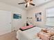 Comfortable bedroom featuring a TV, desk, closet and natural light at 8035 Pastime Ln, Clover, SC 29710