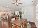Open-concept dining area features a modern table, chairs, chandelier and access to the kitchen and living spaces at 8035 Pastime Ln, Clover, SC 29710