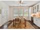 Cozy dining area with modern lighting, natural light and wine storage for entertaining at 8035 Pastime Ln, Clover, SC 29710