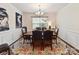Elegant dining room with a large table, six chairs, and stylish decor for Gathering meals at 8035 Pastime Ln, Clover, SC 29710