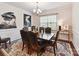 Formal dining room featuring wainscoting, dark wood floors, and a large window at 8035 Pastime Ln, Clover, SC 29710