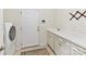 Laundry room featuring a washer, dryer, and countertop with sink at 8035 Pastime Ln, Clover, SC 29710