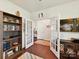 Home office featuring French doors, built-in shelves, and a view into other rooms at 8035 Pastime Ln, Clover, SC 29710