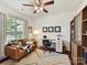 Cozy home office with a comfortable couch, modern desk setup, and ample natural light at 8035 Pastime Ln, Clover, SC 29710
