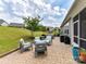 Back patio area with furniture and a landscaped yard view at 8035 Pastime Ln, Clover, SC 29710