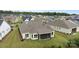 Aerial view of a well-maintained home, lush green lawn, and screened-in porch in a quiet neighborhood at 82120 Standing Oak Dr, Charlotte, NC 28278