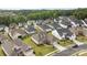 Stunning aerial view of a neighborhood showcasing well-maintained homes and lush green lawns at 82120 Standing Oak Dr, Charlotte, NC 28278