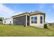 Lush backyard featuring a screened porch and well-maintained green lawn, ideal for relaxation and outdoor activities at 82120 Standing Oak Dr, Charlotte, NC 28278