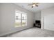 Cozy bedroom with plush carpet, large window and neutral color palette at 82120 Standing Oak Dr, Charlotte, NC 28278