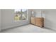 Bright bedroom with large window and hardwood dresser with lamps at 82120 Standing Oak Dr, Charlotte, NC 28278