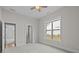Spacious bedroom with ample natural light, large windows and neutral color palette at 82120 Standing Oak Dr, Charlotte, NC 28278