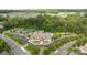 Aerial shot featuring community center with tennis courts, pool and verdant trees at 82120 Standing Oak Dr, Charlotte, NC 28278