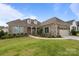 Charming brick home with manicured lawn, two-car garage and inviting front entrance with beautiful landscaping at 82120 Standing Oak Dr, Charlotte, NC 28278