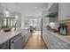 Stylish kitchen with modern fixtures, an island, and a view to the dining area at 82120 Standing Oak Dr, Charlotte, NC 28278