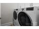 Convenient laundry room with front loading washer and dryer on main level at 82120 Standing Oak Dr, Charlotte, NC 28278