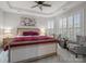 Cozy main bedroom with natural light, tray ceiling, and elegant furnishings at 82120 Standing Oak Dr, Charlotte, NC 28278