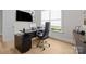 Modern office space with a black desk, sleek chair, and natural light at 82120 Standing Oak Dr, Charlotte, NC 28278