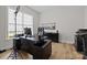 Bright office space with a modern desk, dark cabinets, and a large window at 82120 Standing Oak Dr, Charlotte, NC 28278