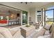 Relaxing screened-in porch with wicker seating, ceiling fan, and indoor/outdoor living space at 82120 Standing Oak Dr, Charlotte, NC 28278