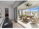 Relaxing sunroom featuring wicker furniture, ceiling fan and sliding glass doors to connect indoor and outdoor living at 82120 Standing Oak Dr, Charlotte, NC 28278
