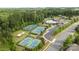 Aerial shot of tennis courts and community recreation, nestled in a scenic wooded area at 82120 Standing Oak Dr, Charlotte, NC 28278