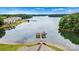 Breathtaking aerial view featuring a private dock and waterfront condos on a serene lake with lush green surroundings at 860 Jetton St # 59, Davidson, NC 28036
