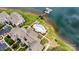 Aerial view showcases condos with a community pool along a waterfront property, perfectly landscaped with parking at 860 Jetton St # 59, Davidson, NC 28036