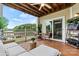 Relaxing covered balcony featuring comfortable seating and picturesque views of the lake at 860 Jetton St # 59, Davidson, NC 28036