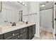 Elegant bathroom featuring double sinks with modern fixtures and a separate toilet room at 860 Jetton St # 59, Davidson, NC 28036