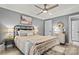 Bright bedroom features a ceiling fan, gray walls and hardwood floors, offering a cozy and modern ambiance at 860 Jetton St # 59, Davidson, NC 28036