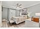 Well-lit bedroom features a ceiling fan, plantation shutters, and neutral walls creating a serene and inviting retreat at 860 Jetton St # 59, Davidson, NC 28036
