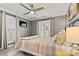 Comfortable bedroom with ceiling fan, plantation shutters, and neutral walls creating a serene and inviting retreat at 860 Jetton St # 59, Davidson, NC 28036