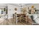 Cozy dining area featuring a wooden table, art-filled wall, and modern decor at 860 Jetton St # 59, Davidson, NC 28036
