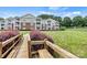 Condo exterior with lush greenery and landscaped grounds, offering a serene and picturesque setting at 860 Jetton St # 59, Davidson, NC 28036